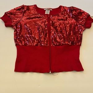 Tag 1080 red sequins girl top size LARGE with front zipper, ribbed midriff. NWOT